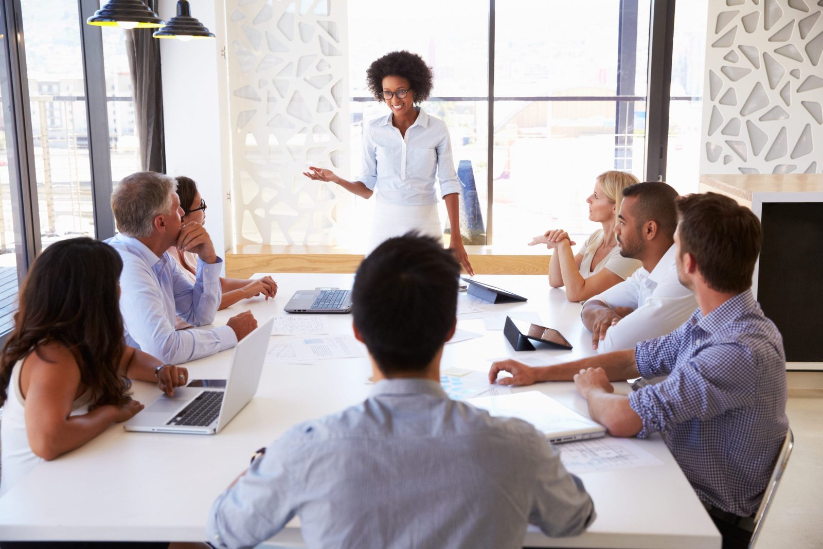 Businesswoman presenting to colleagues at a meeting